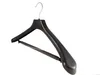 A black suit hanger with a metal hook on a white background. Produktbild-Vorschau