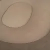 A close-up view of a beige inflatable lounger with a footrest. Produktbild-Vorschau