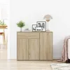A wooden sideboard with drawers and doors, decorated with framed pictures and a plant. Anteprima dell’immagine prodotto