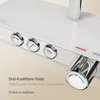 A close-up view of a modern white shower control panel with chrome accents and buttons. Náhled obrázku produktu