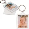 Two acrylic frame keychains, one with a couple and the other with a baby, against a white background. Produktbild-Vorschau