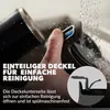 A hand is shown rinsing a part of a black product under running water, with text overlays describing its features. Produktbild-Vorschau