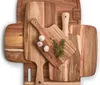 A collection of wooden cutting boards with garlic and rosemary on one of them. Anteprima dell’immagine prodotto