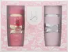 A gift set of two perfumes, one red and one pink, in a decorative box. Voir les images du produit