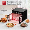 A kitchen counter displaying a black oven with food items like a roasted chicken, pizza, and lamb chops. Produktbild-Vorschau