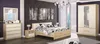 A bedroom set with a bed, dresser, nightstand, and wardrobe, all in a modern style. Náhled obrázku produktu