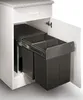 A pull-out trash bin system with two compartments installed in a kitchen cabinet. Podgląd zdjęcia produktu