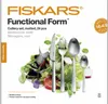 A Fiskars cutlery set is displayed with a salad in the background. Produktbild-Vorschau