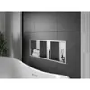 A modern bathroom with a built-in shelf in a tiled wall, containing toiletries and towels, next to a bathtub. Náhled obrázku produktu