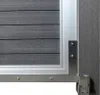 Close-up view of a gate hinge and frame. Produktbild-Vorschau