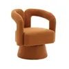 A studio shot of a single orange armchair. Voir les images du produit