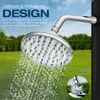 A close-up of a shower head with water spraying, set against a green grassy background and a blue sky. Produktbild-Vorschau