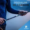 A person holding a trekking pole with a blurred background of water and sky. Produktbild-Vorschau