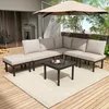 An outdoor patio scene with a sectional sofa, coffee table, and umbrella. Anteprima dell’immagine prodotto