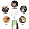 A collage of images showing a white and black MiLi MiTag smart geo tag being used in various applications like attaching to luggage, bags, keys, and pets, along with a smartphone displaying a map interface. Voir les images du produit