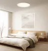 A bedroom scene with a bed, nightstand, and artwork. Náhľad obrázku produktu