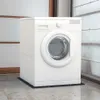 A white washing machine is shown on a black anti-vibration mat on a marble floor, with a wall in the background. Náhľad obrázku produktu