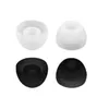 Four earbud tips, two white and two black, are arranged in a two-by-two grid against a white background. Náhľad obrázku produktu