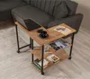 A side table with a laptop, books, and a drink next to a sofa. Voir les images du produit