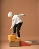 A child is playing on a set of colorful foam climbing blocks. Anteprima dell’immagine prodotto