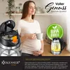 A pregnant woman holding a mug in a kitchen setting, with a kettle and a food processor shown. Produktbild-Vorschau