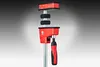 A red and black clamp is shown against a gradient background. Produktbild-Vorschau