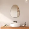 A modern bathroom vanity with a sink, faucet, and an oval mirror. Náhľad obrázku produktu
