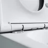 A close-up view of the hinge mechanism of a white toilet seat. Produktbild-Vorschau