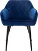 A single dark blue armchair with diamond quilting on the back and arms, and black metal legs, is shown against a white background. Náhled obrázku produktu