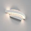 A white LED outdoor wall light mounted on a light gray wall. Produktbild-Vorschau