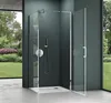 A modern bathroom with a glass shower enclosure and a view of a garden. Produktbild-Vorschau