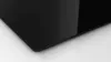 A close-up of the corner of a black glass cooktop. Produktbild-Vorschau