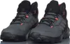 A pair of gray and black Adidas Terrex hiking boots are shown from a front-facing angle against a white background. Produktbild-Vorschau