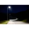 A road at night with streetlights and stars. Produktbild-Vorschau
