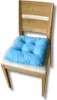 A blue cushion is placed on a wooden chair with a white seat cushion. Podgląd zdjęcia produktu