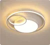 A modern ceiling light with a circular design and LED lighting.
