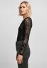 A woman is shown from the side wearing a black lace long-sleeved bodysuit and dark wash jeans against a plain gray background. Produktbild-Vorschau