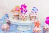 A collection of mermaid-themed cupcakes decorated with colorful toppers. Produktbild-Vorschau