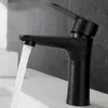 A black faucet in a bathroom, with water running into a sink. Náhľad obrázku produktu