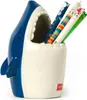 A ceramic pen holder shaped like a shark's head, filled with pens and pencils. Podgląd zdjęcia produktu