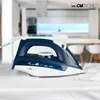 A blue and white steam iron is placed on a white surface, with a blurred kitchen background. Náhľad obrázku produktu