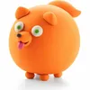 A small, round, orange clay dog with green eyes and its tongue sticking out, standing on four small legs. Podgląd zdjęcia produktu