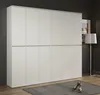 A tall, white wardrobe with 12 doors is shown in a room. A floor lamp and a picture frame are visible in the background. Two green high-heeled shoes are placed on a gray rug in front of the wardrobe. Produktbild-Vorschau