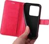 A hand holding a red flip phone case with floral and butterfly embossed details, revealing the black inner phone holder. Produktbild-Vorschau