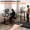 Two people using adjustable height desks in an office setting. Voir les images du produit