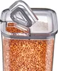 A close-up of a clear plastic food storage container filled with red lentils. Produktbild-Vorschau