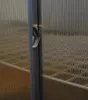 A close-up view of a metal latch on a textured glass surface. Produktbild-Vorschau