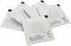 A stack of small, white, square packets with a stylized leaf logo and text. Podgląd zdjęcia produktu