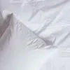 A close-up view of white pillowcases, showing their texture and folds. Produktbild-Vorschau