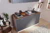 A compact kitchen unit with a sink, stovetop, and cabinets, set in a domestic environment. Produktbild-Vorschau